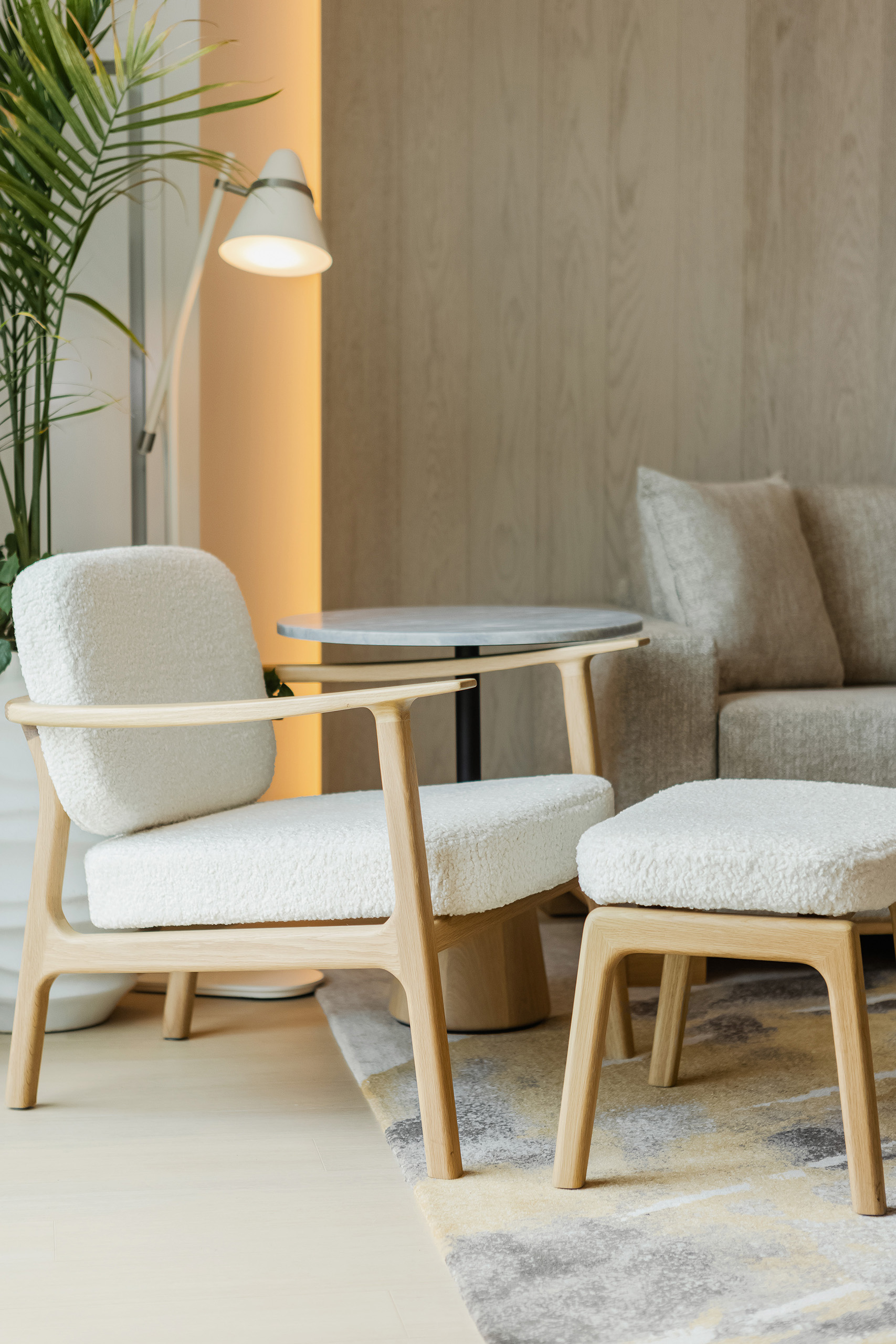 White fabric chair with matching ottoman