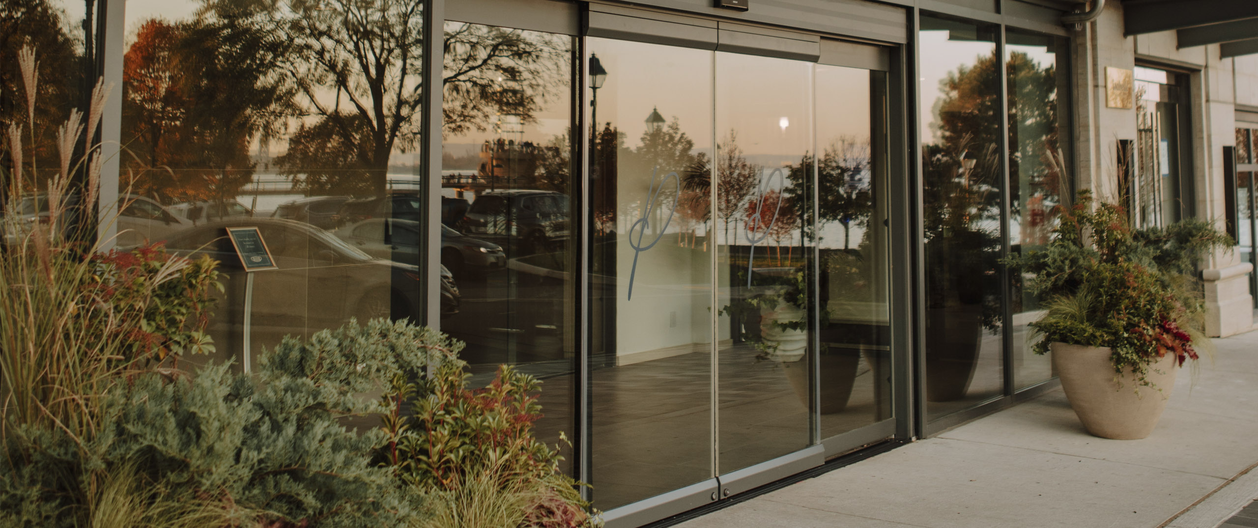 Exterior Lobby Entrance of The Pearle Hotel with large glass doors