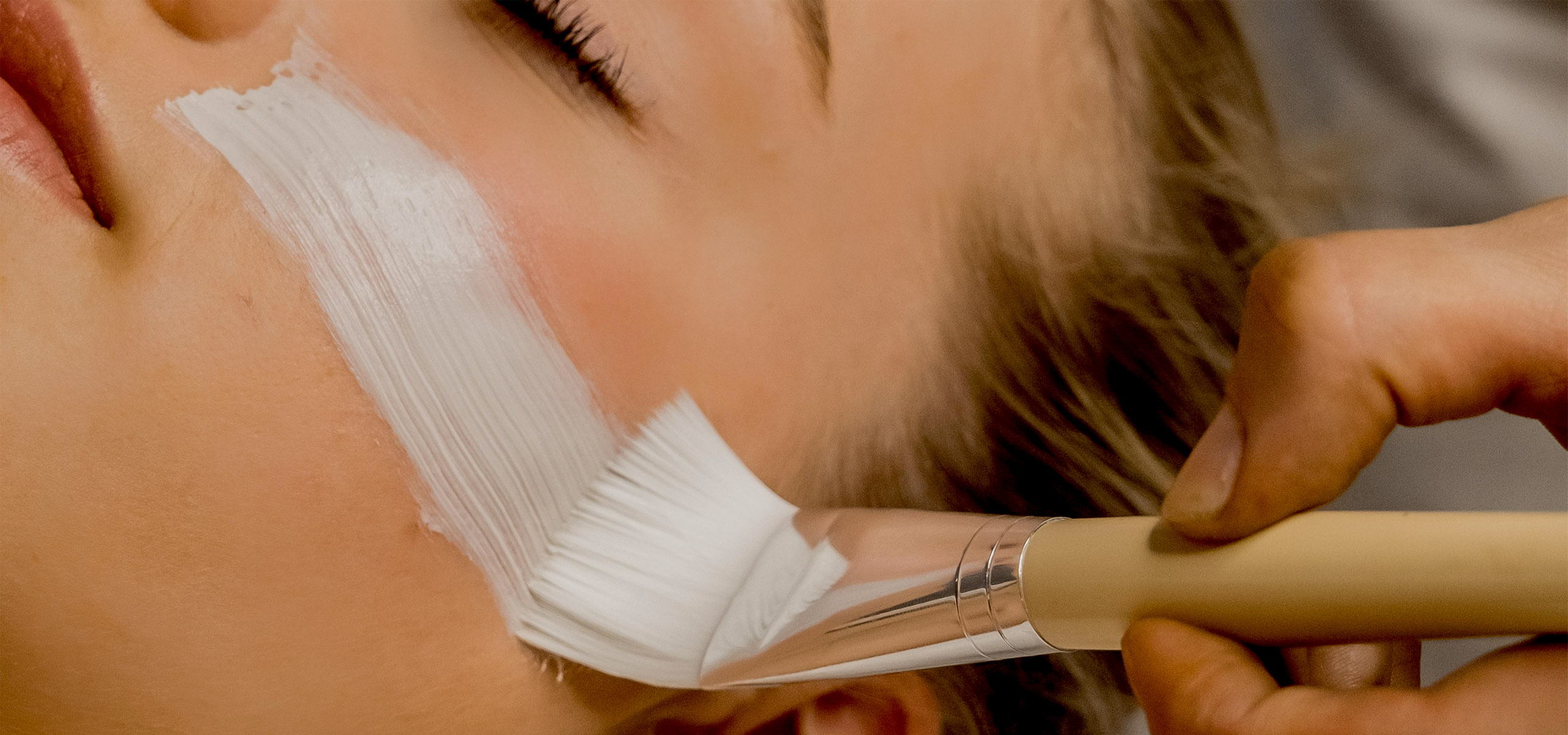 Undistinguishable woman getting a facial treatment at The Pearle Hotel