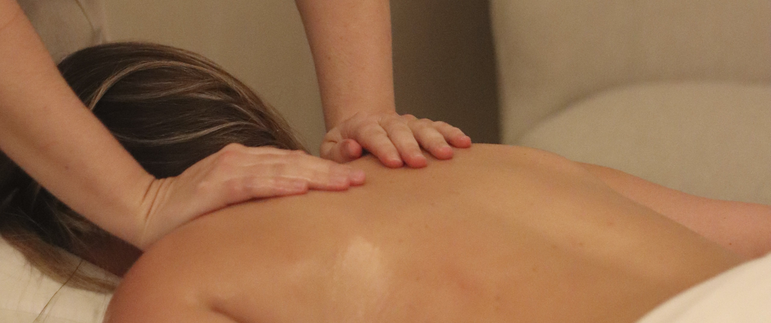 Undistinguishable person receiving a massage treatment at The Pearle Hotel & Spa